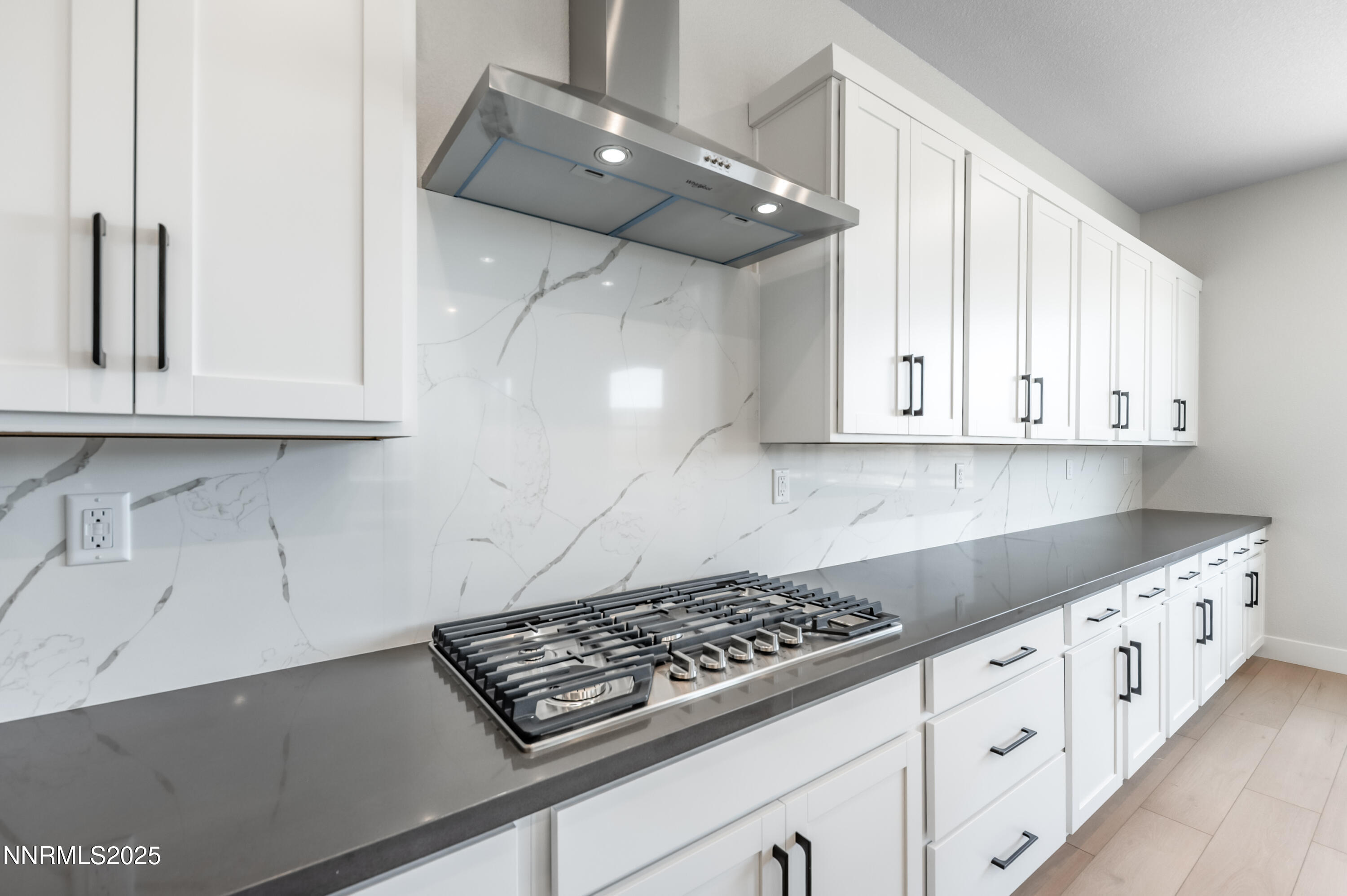 1357 Silver View Circle Sparks, NV 89436 - Photo 10 of 44 a kitchen with white cabinets and appliances