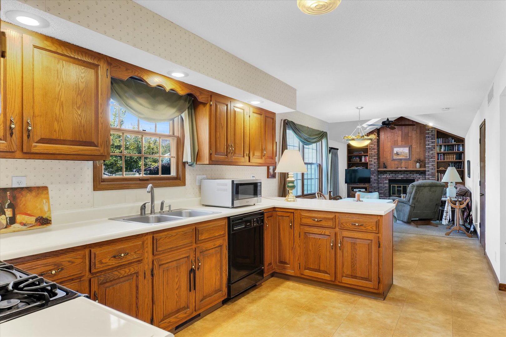 2011 O Donnell Drive Champaign, IL 61821 - Photo 13 of 43 a kitchen with a sink cabinets and window