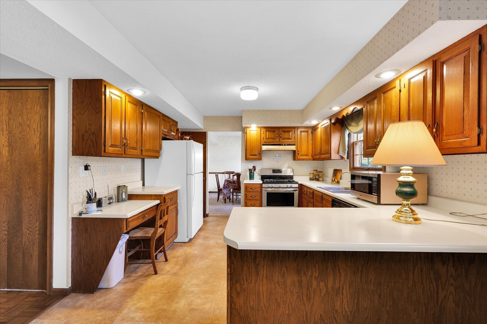 2011 O Donnell Drive Champaign, IL 61821 - Photo 15 of 43 a kitchen with counter top space cabinets and stainless steel appliances