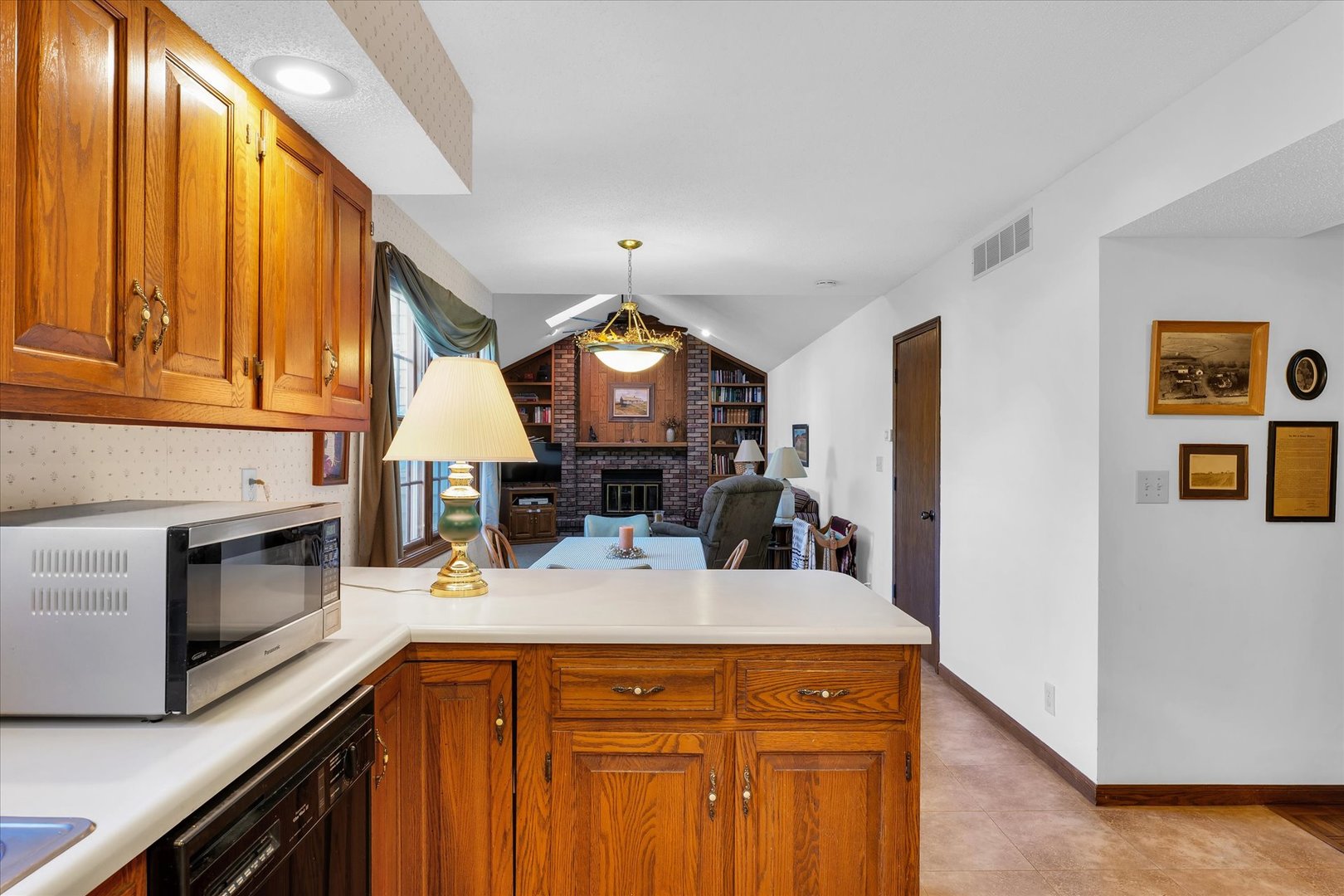 2011 O Donnell Drive Champaign, IL 61821 - Photo 17 of 43 a kitchen with a stove a sink and a microwave