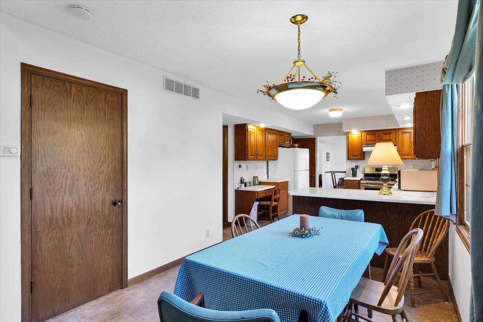 2011 O Donnell Drive Champaign, IL 61821 - Photo 19 of 43 a view of a dining room with furniture window and wooden floor