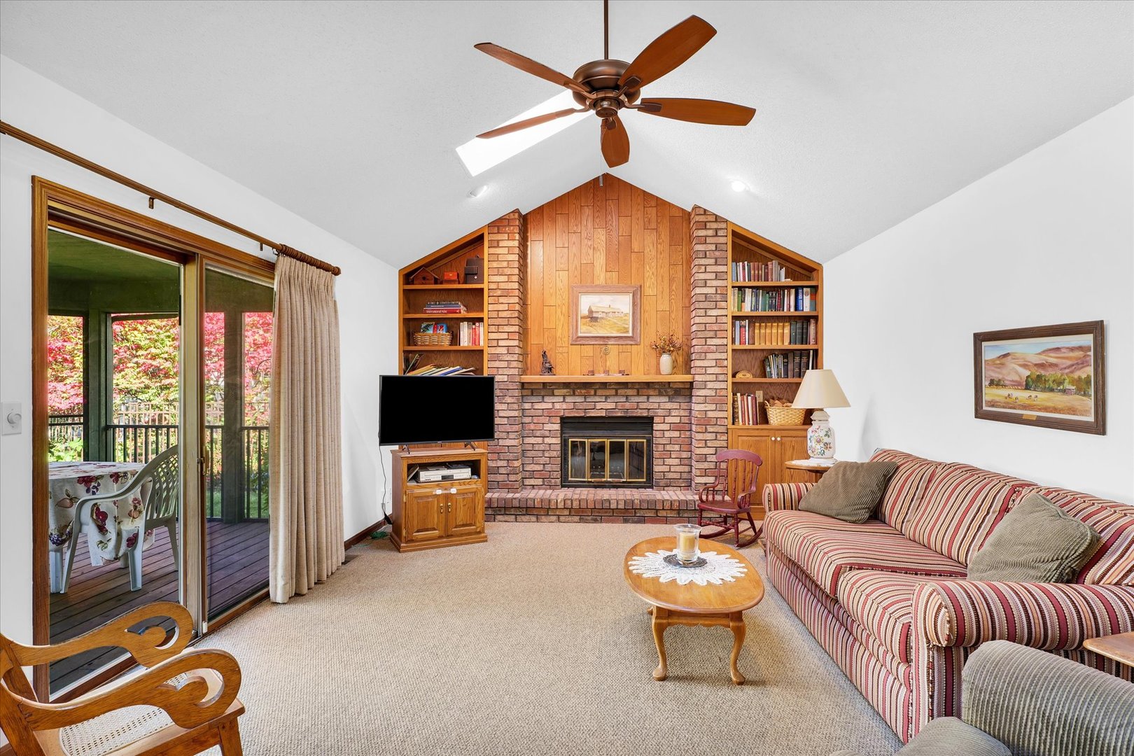 2011 O Donnell Drive Champaign, IL 61821 - Photo 20 of 43 a living room with furniture a fireplace and a flat screen tv