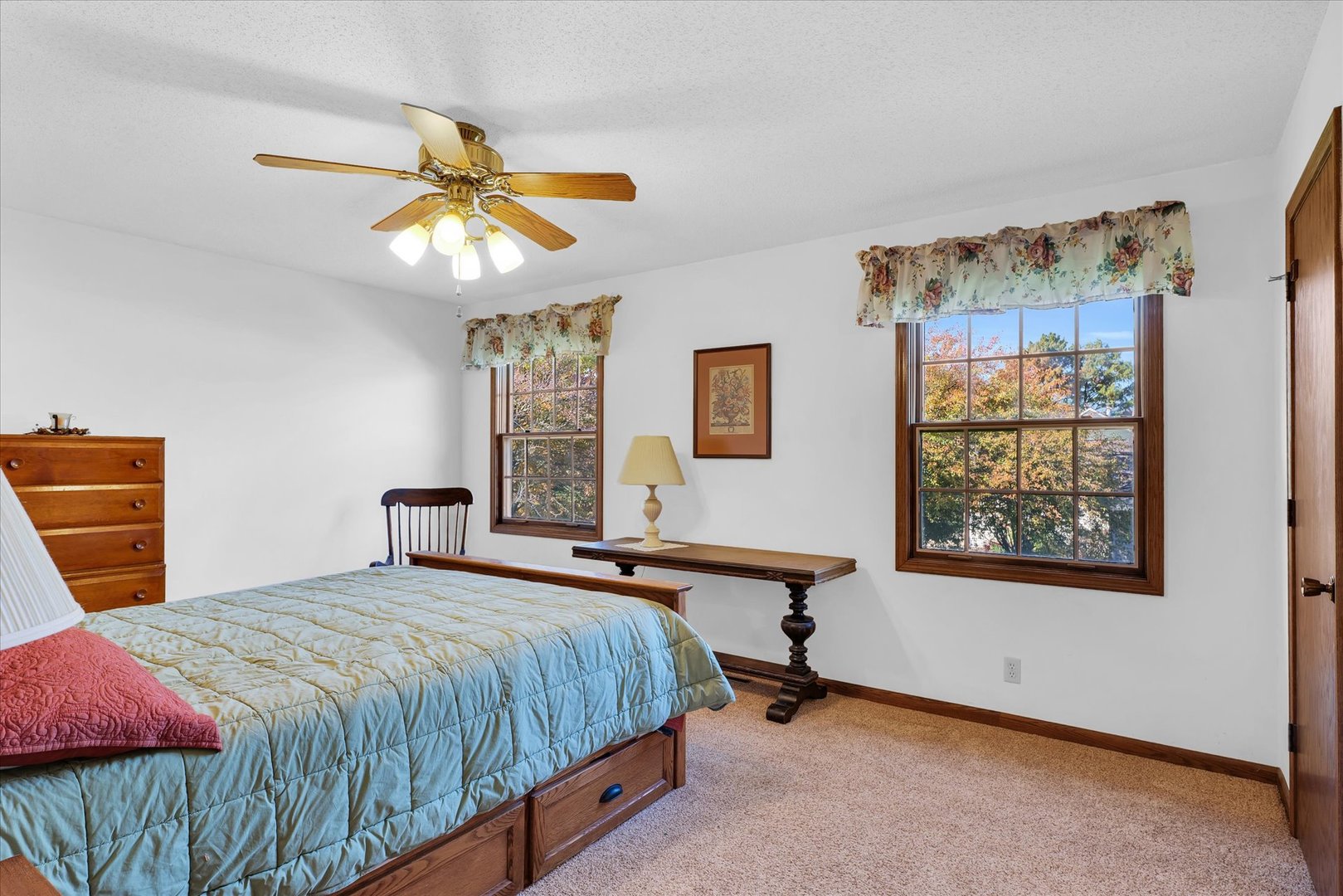 2011 O Donnell Drive Champaign, IL 61821 - Photo 31 of 43 a bedroom with a bed and a chandelier