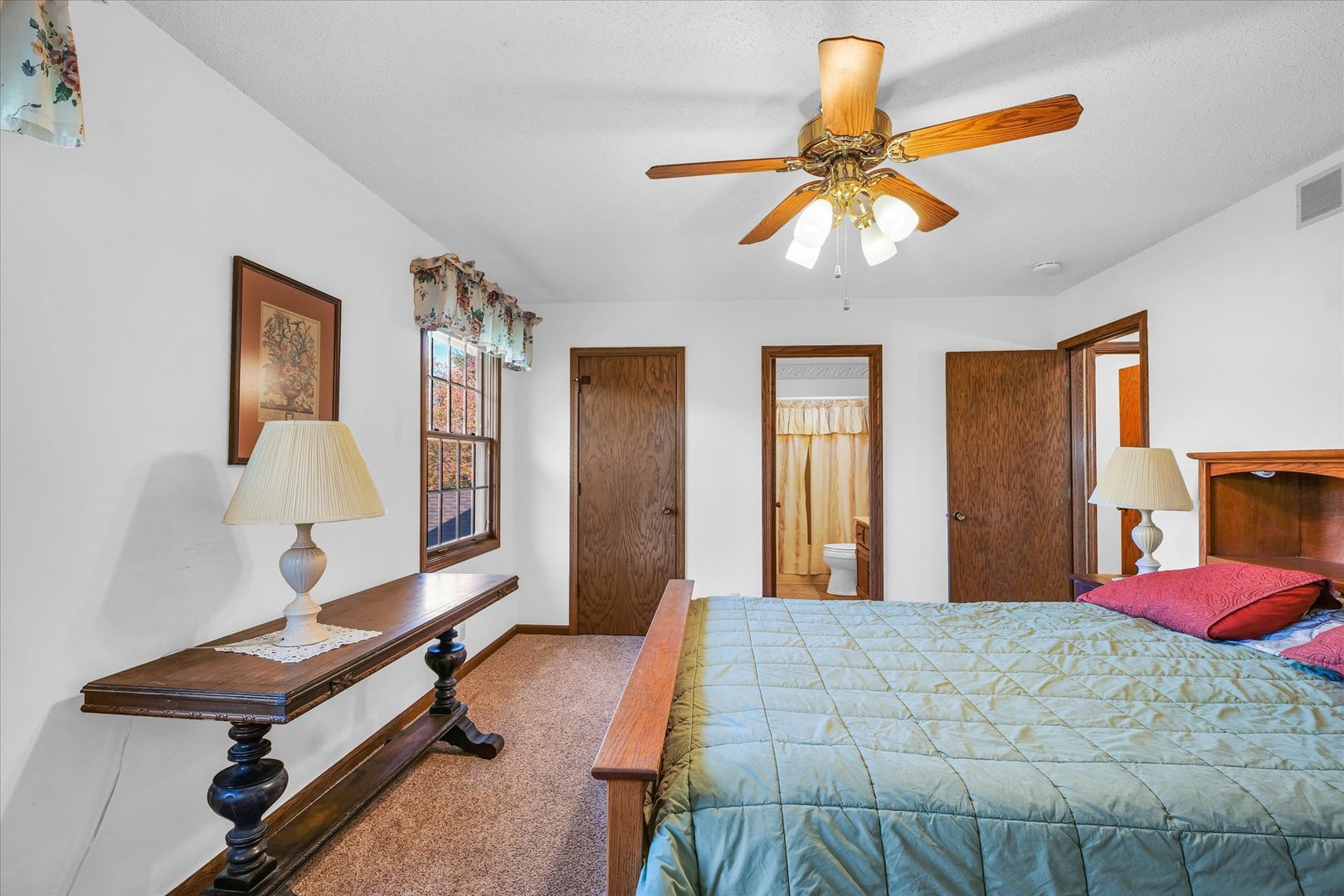 2011 O Donnell Drive Champaign, IL 61821 - Photo 32 of 43 a bedroom with a bed and a chandelier