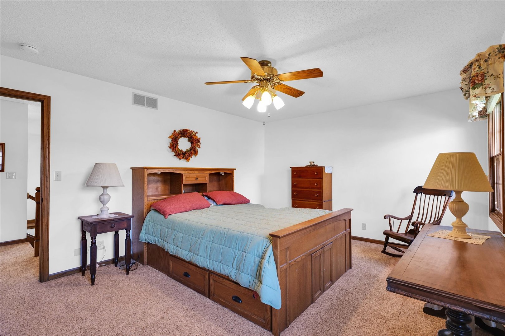 2011 O Donnell Drive Champaign, IL 61821 - Photo 33 of 43 a bedroom with a bed and a chandelier