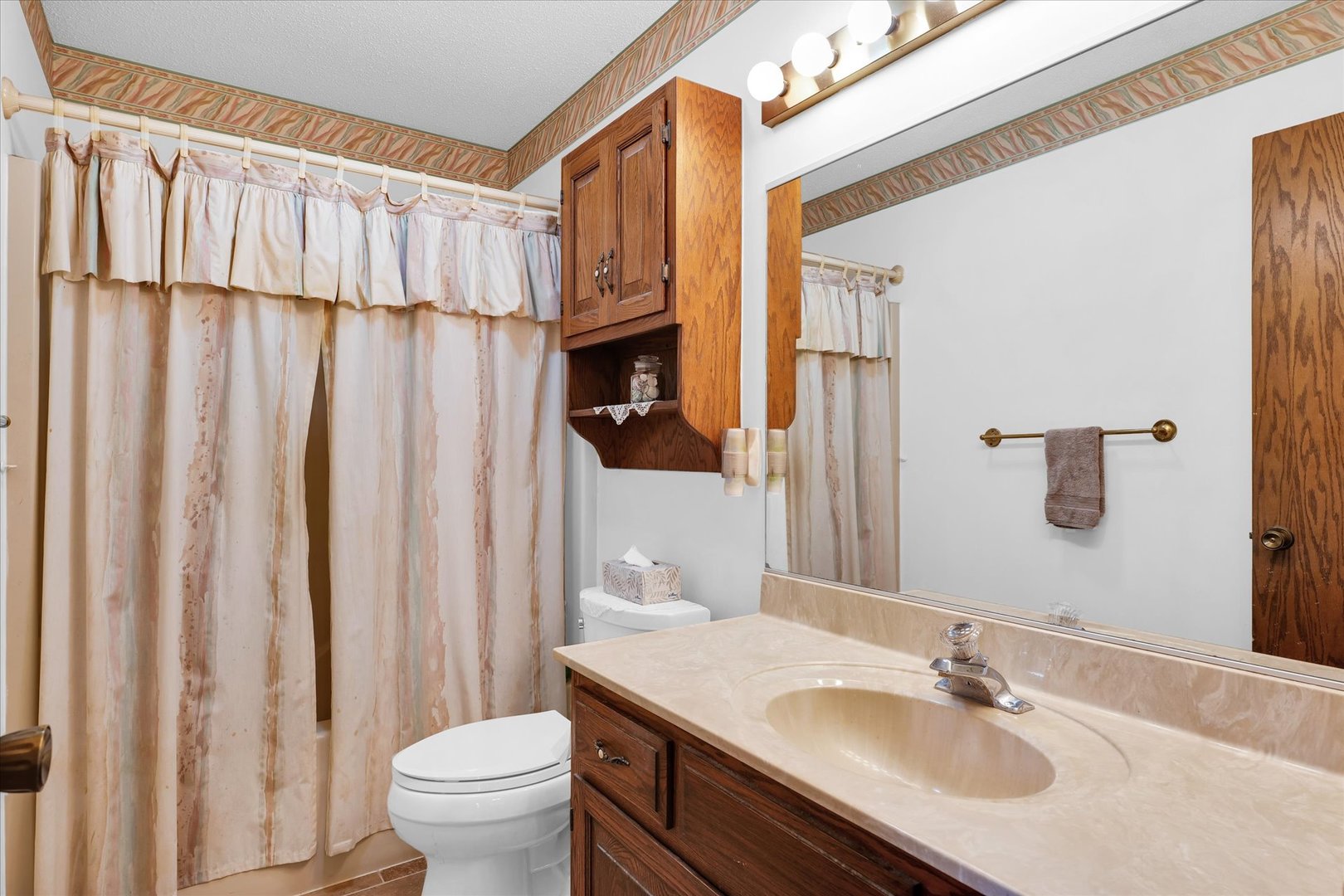 2011 O Donnell Drive Champaign, IL 61821 - Photo 34 of 43 a bathroom with a sink a toilet and shower curtain