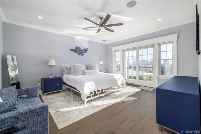 a spacious bedroom with a bed and a large window