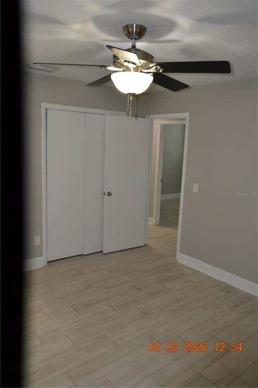 6204 West Knights Griffin Road Plant City, FL 33565 - Photo 11 of 19 a view of a chandelier fan and entryway