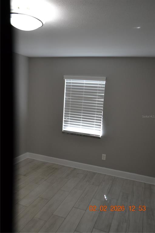 6204 West Knights Griffin Road Plant City, FL 33565 - Photo 14 of 19 an empty room with a window