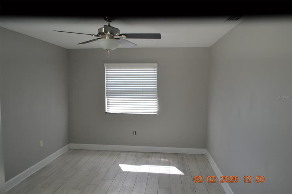 6204 West Knights Griffin Road Plant City, FL 33565 - Photo 6 of 19 an empty room with a window