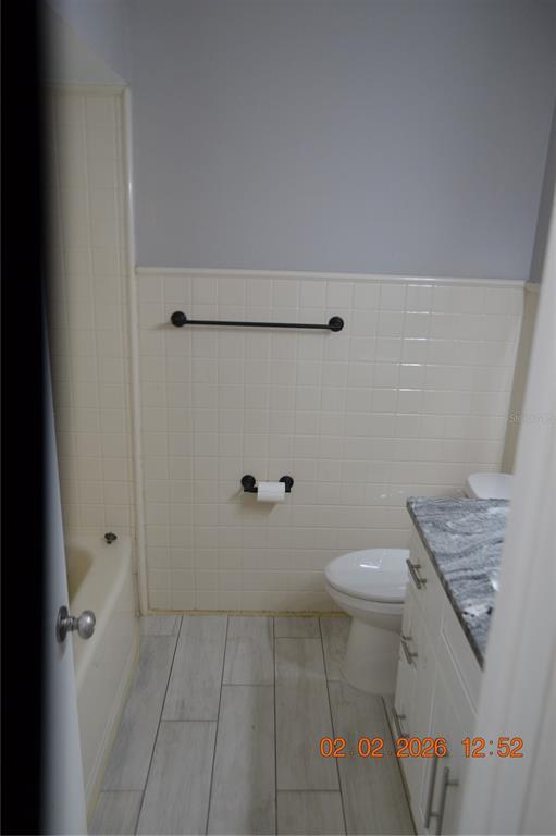 6204 West Knights Griffin Road Plant City, FL 33565 - Photo 10 of 19 a bathroom with a toilet and a shower