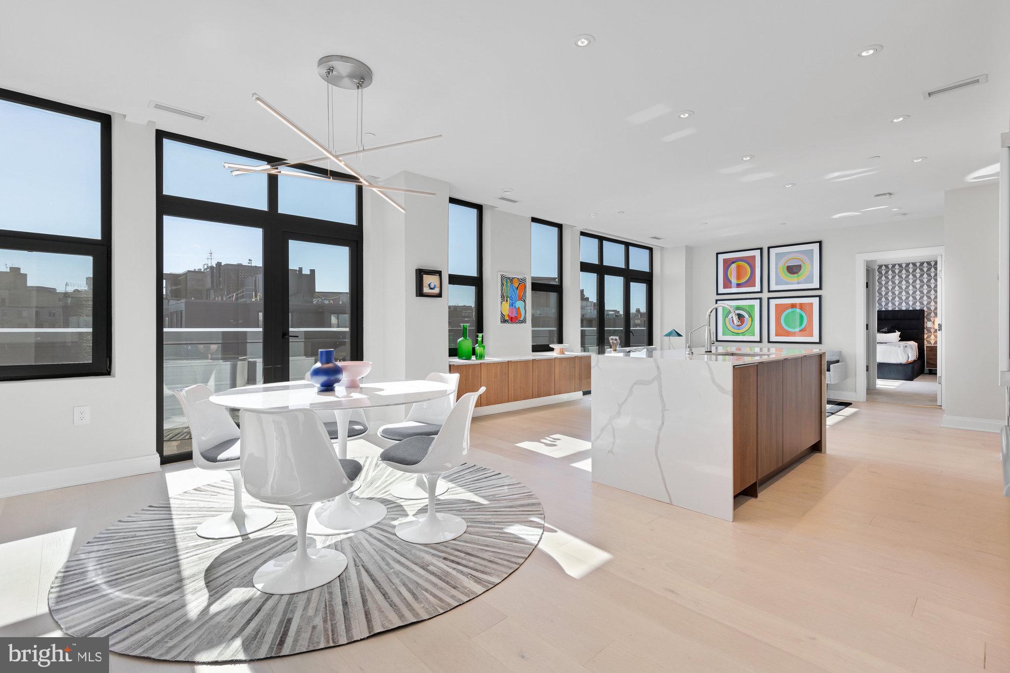 a living room with furniture and large window