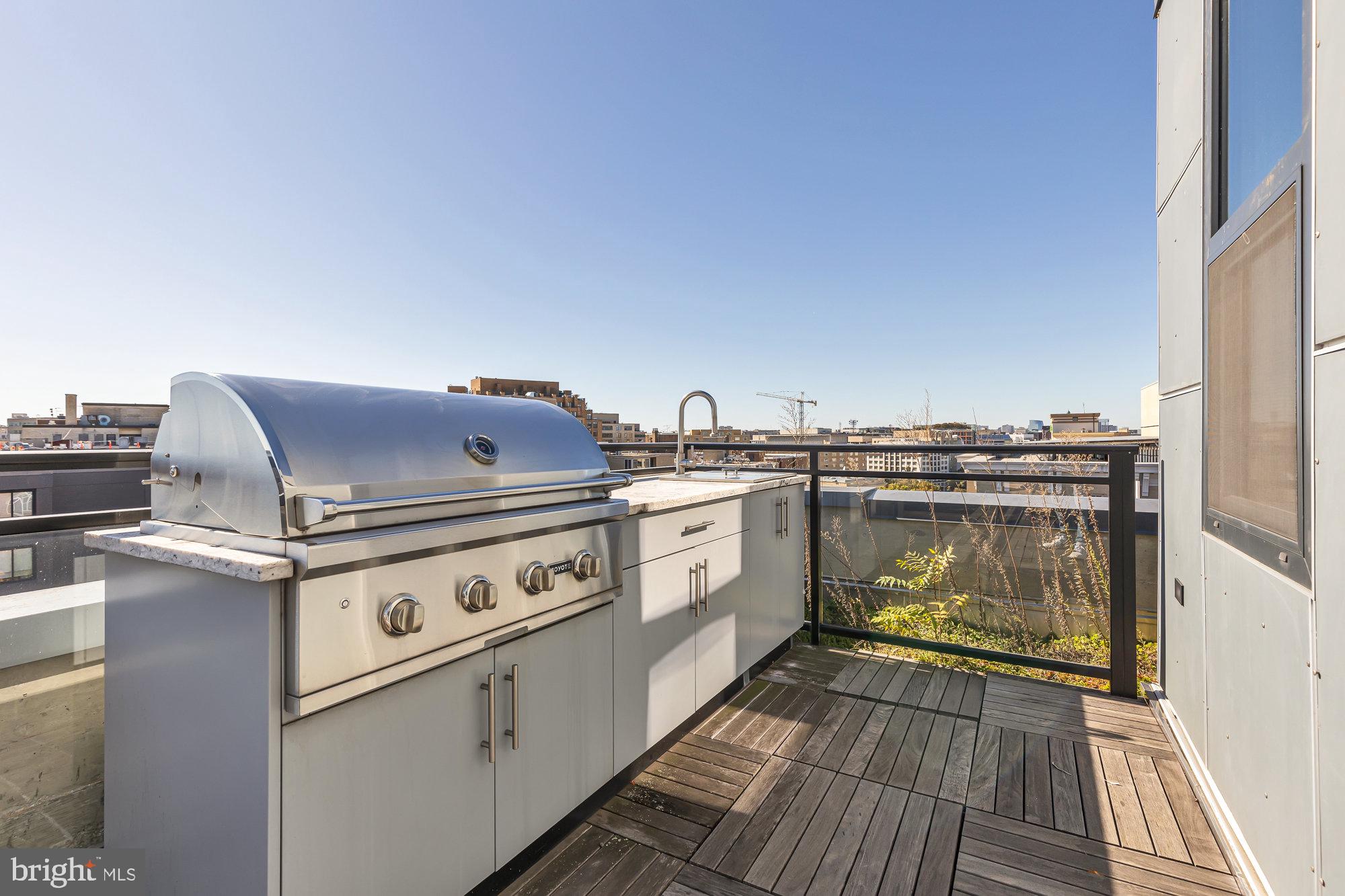 1427 Rhode Island Avenue Northwest, Unit PH01 Washington, DC 20005 - Photo 12 of 39 a utility room with washer and dryer