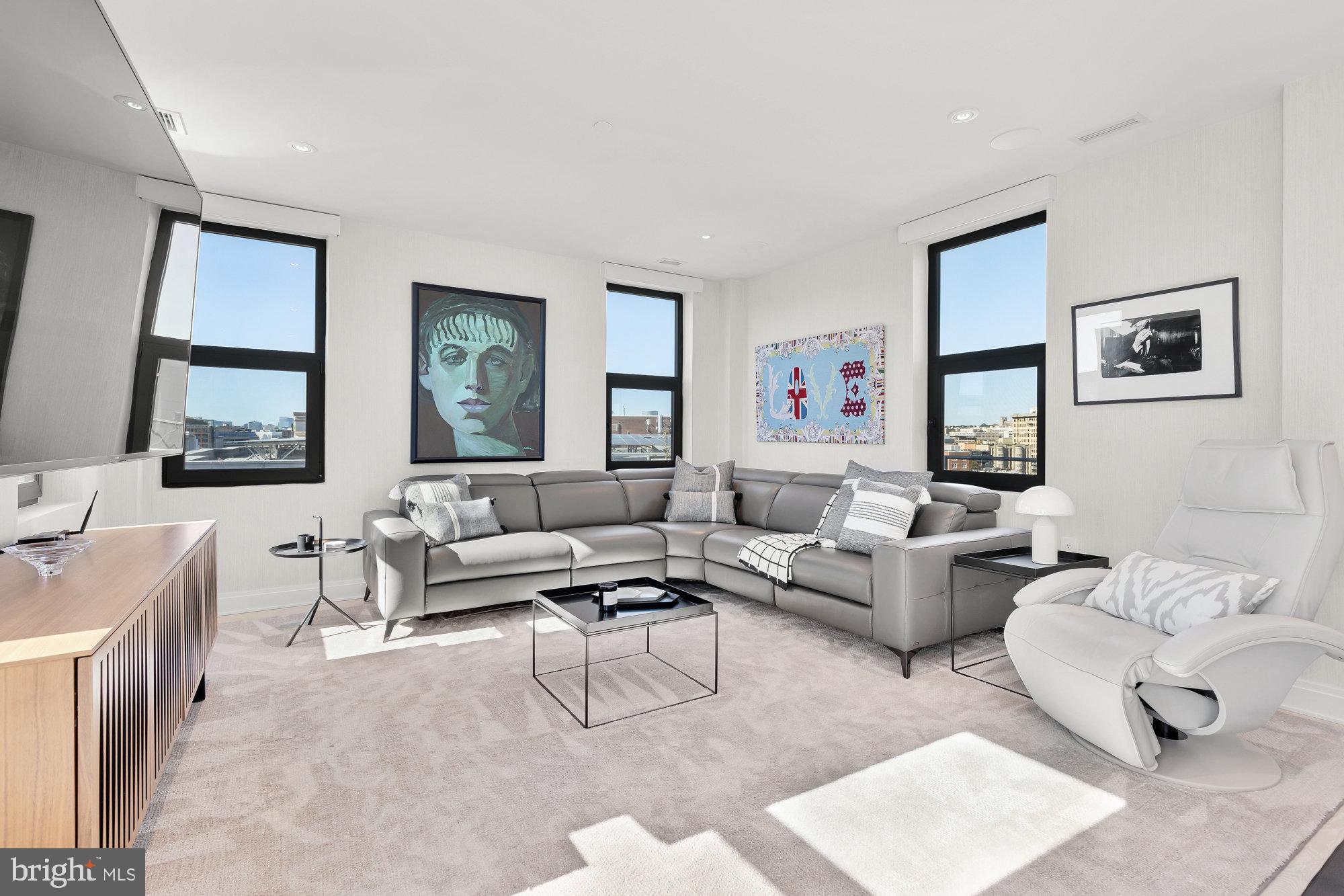 1427 Rhode Island Avenue Northwest, Unit PH01 Washington, DC 20005 - Photo 17 of 39 a living room with furniture and a window