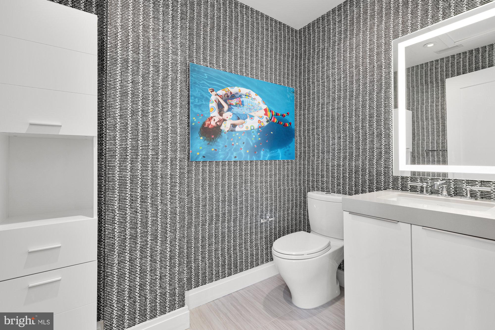 1427 Rhode Island Avenue Northwest, Unit PH01 Washington, DC 20005 - Photo 18 of 39 a bathroom with a toilet and a sink