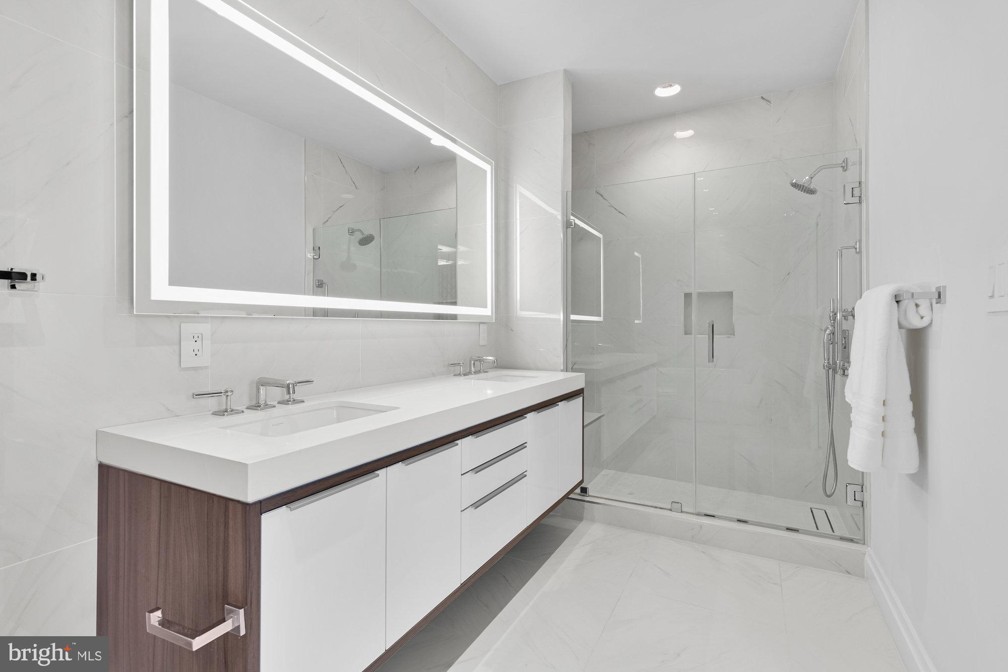 1427 Rhode Island Avenue Northwest, Unit PH01 Washington, DC 20005 - Photo 20 of 39 a bathroom with a sink a toilet and shower