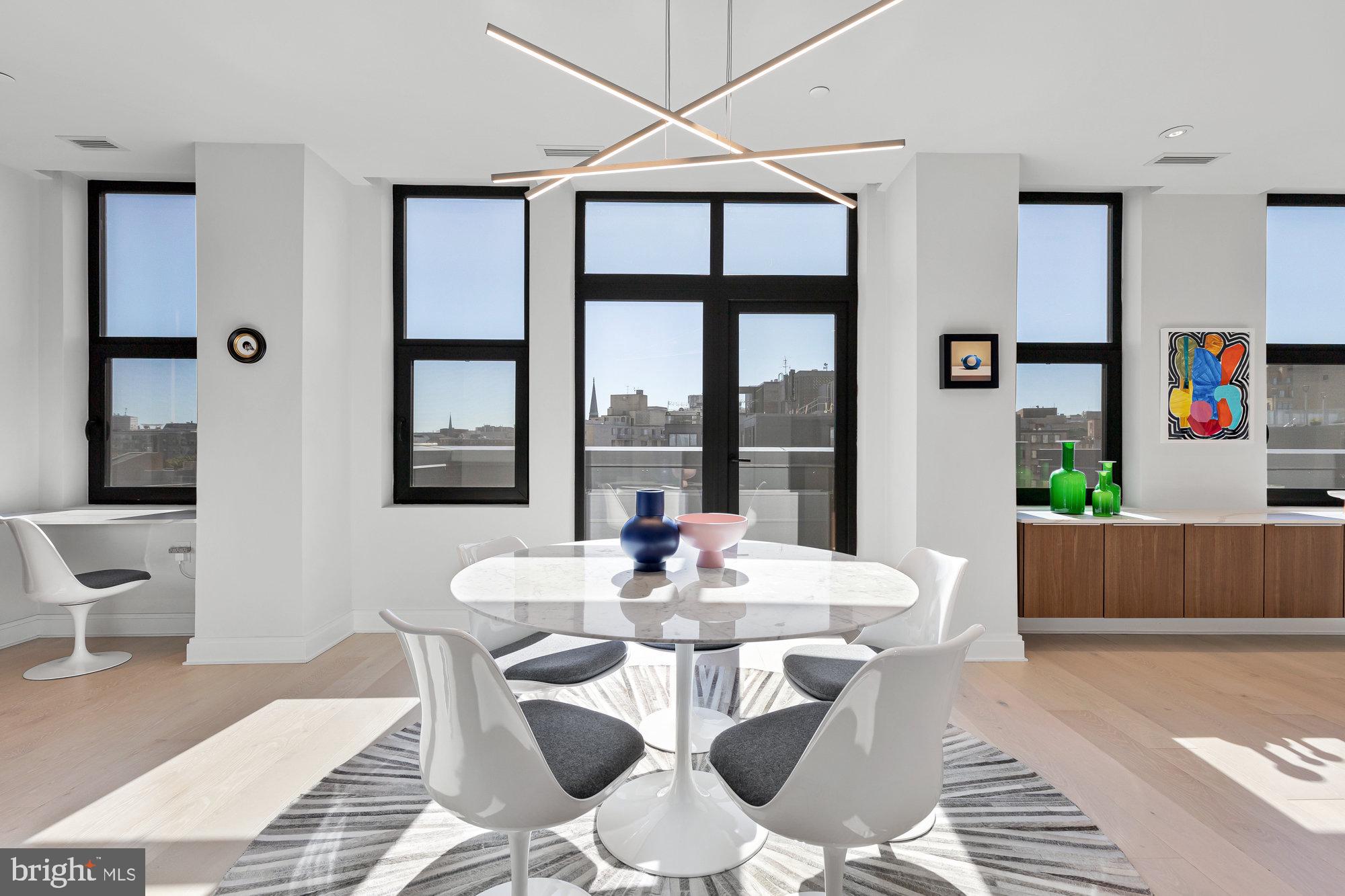 1427 Rhode Island Avenue Northwest, Unit PH01 Washington, DC 20005 - Photo 2 of 39 a view of a dining room with furniture window and outside view