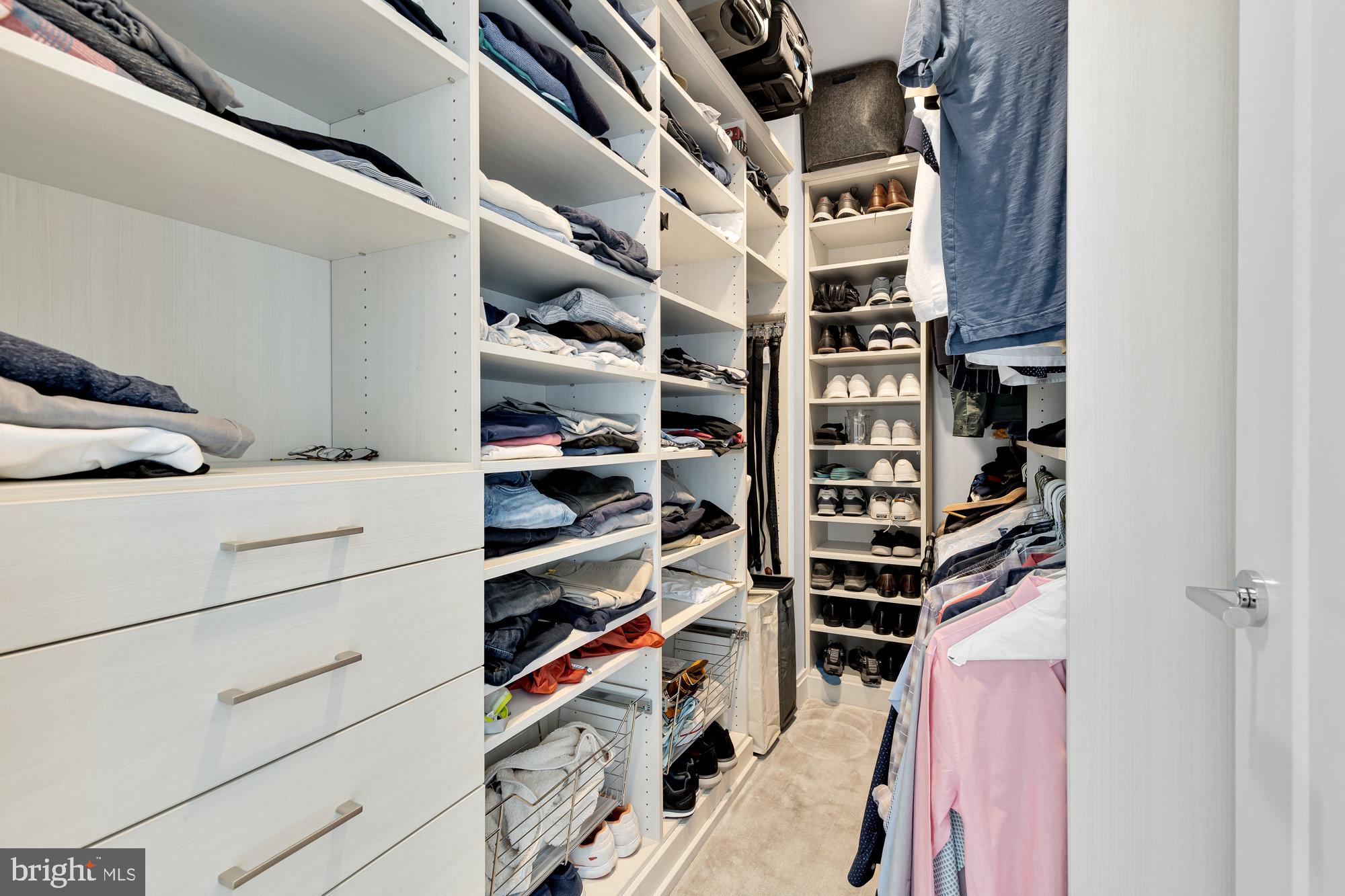 1427 Rhode Island Avenue Northwest, Unit PH01 Washington, DC 20005 - Photo 22 of 39 a view of walk in closet with clothes and shoes