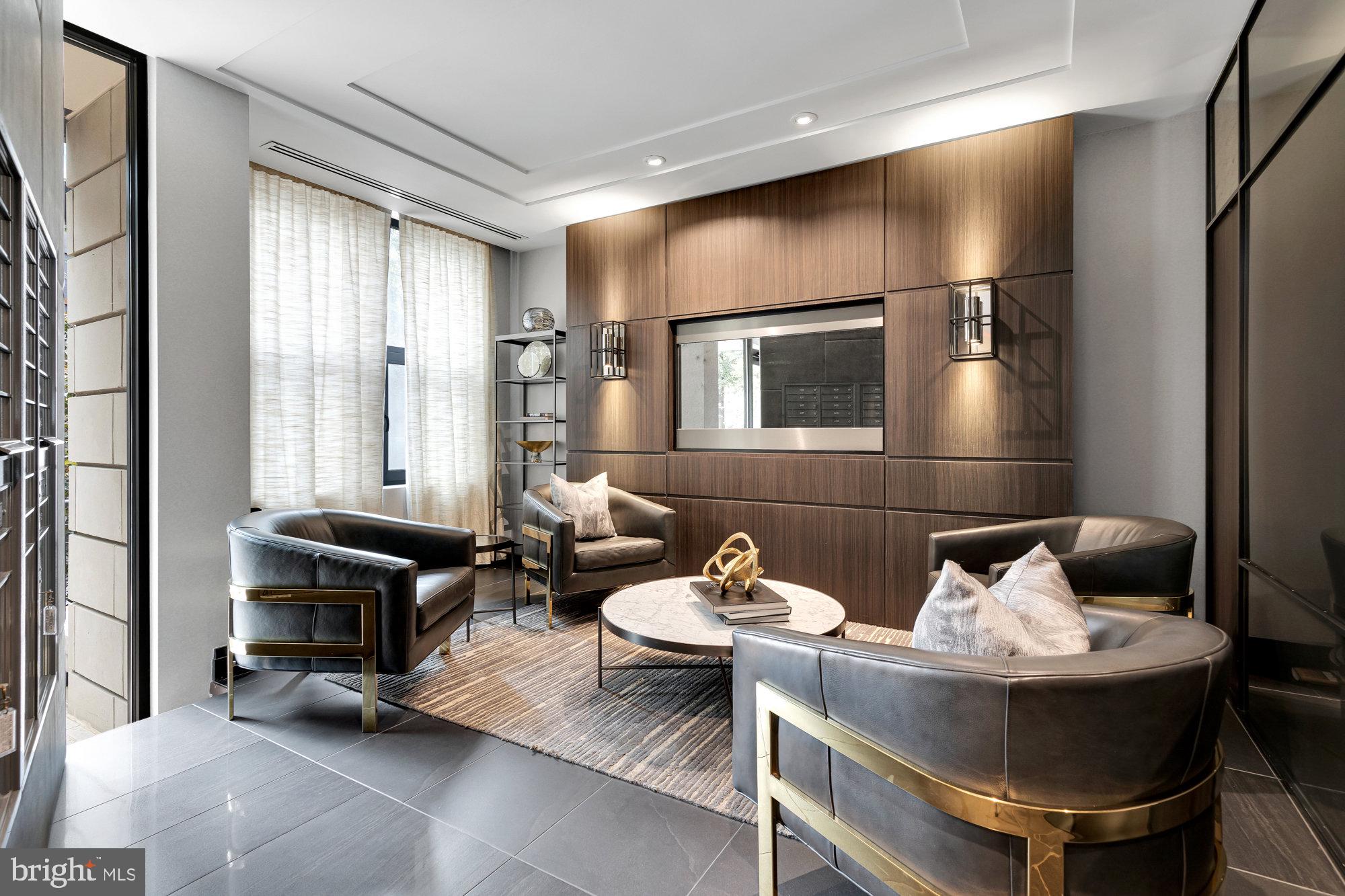 1427 Rhode Island Avenue Northwest, Unit PH01 Washington, DC 20005 - Photo 33 of 39 a living room with furniture and large mirror