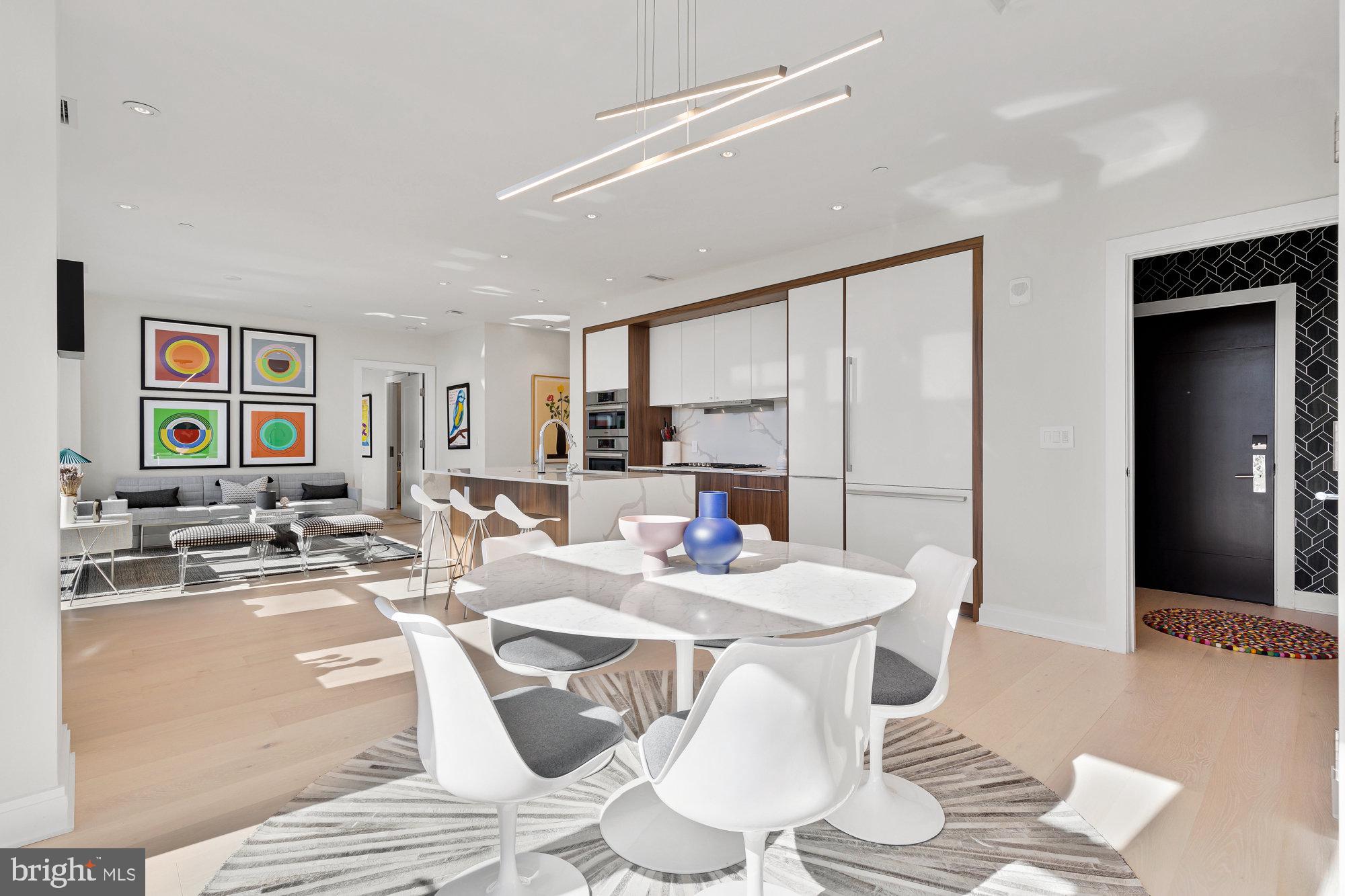 1427 Rhode Island Avenue Northwest, Unit PH01 Washington, DC 20005 - Photo 5 of 39 a dining room with furniture and wooden floor