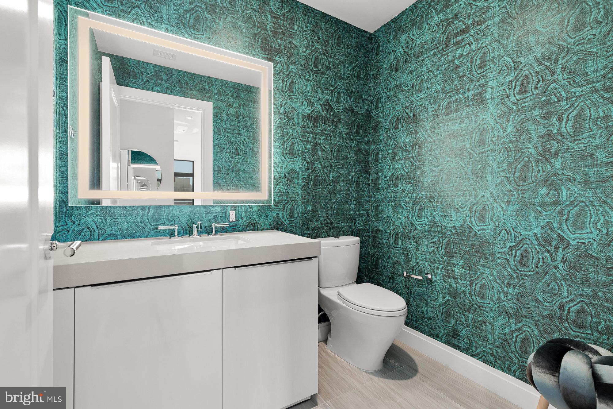 1427 Rhode Island Avenue Northwest, Unit PH01 Washington, DC 20005 - Photo 10 of 39 a bathroom with a toilet sink and mirror