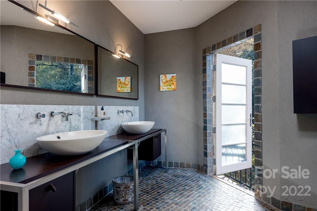 3234 Mountainbrook Road Charlotte, NC 28210 - Photo 33 of 48 a bathroom with a sink and a mirror