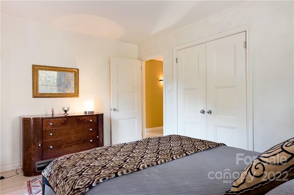 3234 Mountainbrook Road Charlotte, NC 28210 - Photo 38 of 48 a bedroom with a bed and a dresser