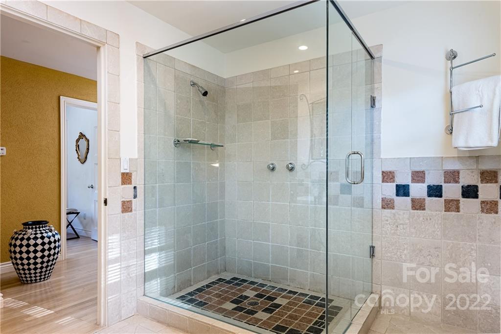 3234 Mountainbrook Road Charlotte, NC 28210 - Photo 39 of 48 a bathroom with a glass shower door
