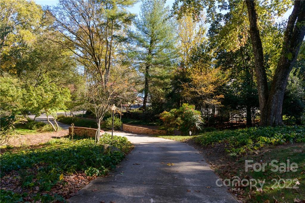 3234 Mountainbrook Road Charlotte, NC 28210 - Photo 4 of 48 a view of an outdoor space with a garden