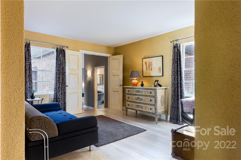 3234 Mountainbrook Road Charlotte, NC 28210 - Photo 42 of 48 a living room with furniture and a wooden floor