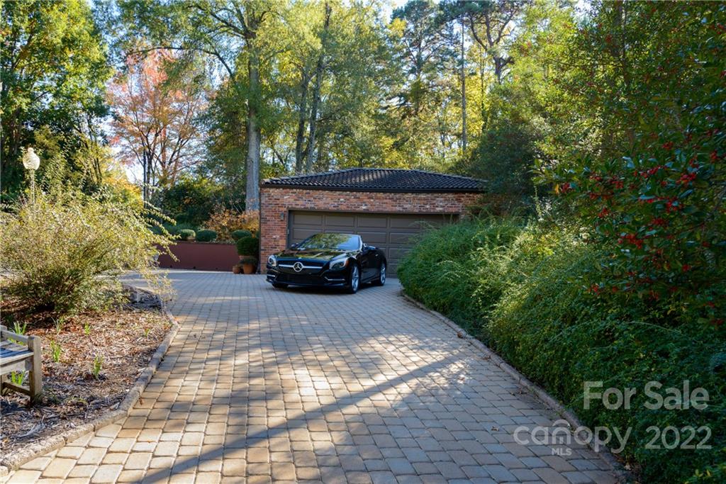 3234 Mountainbrook Road Charlotte, NC 28210 - Photo 46 of 48 a view of house with car parked beside of it