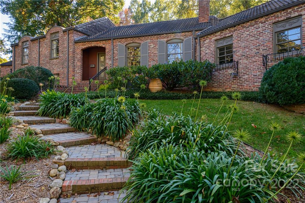 3234 Mountainbrook Road Charlotte, NC 28210 - Photo 5 of 48 a front view of a house with garden