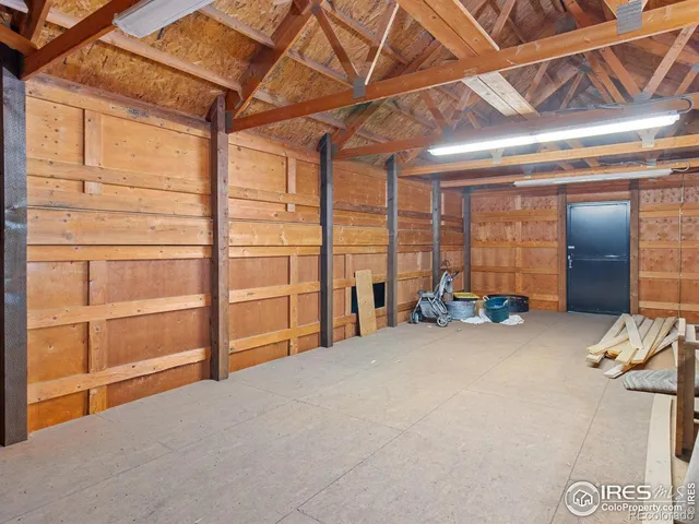 a view of a room with air conditioner duct and materials on floor