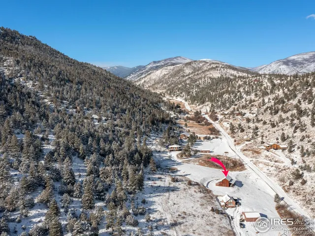 a view of a city with mountains in the background