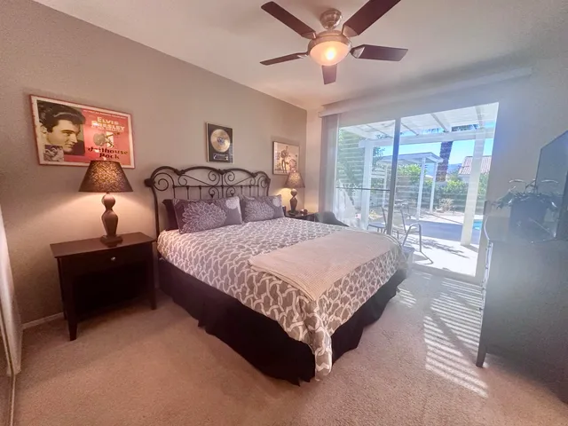 a bed sitting in a bedroom next to a window