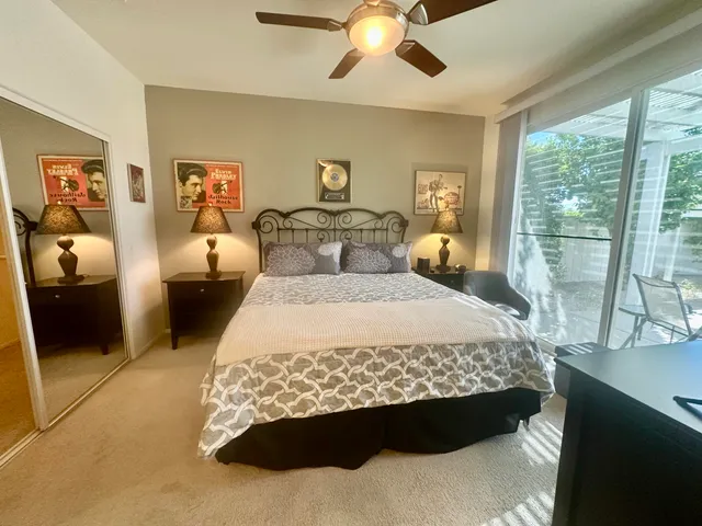 a view of a porch with chairs and backyard