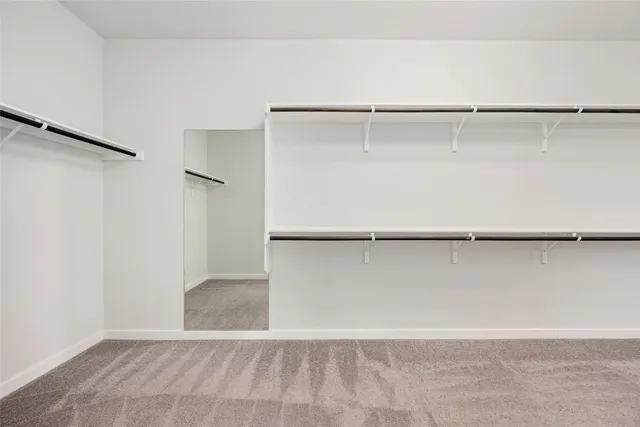 a spacious bathroom with a bathtub and shower