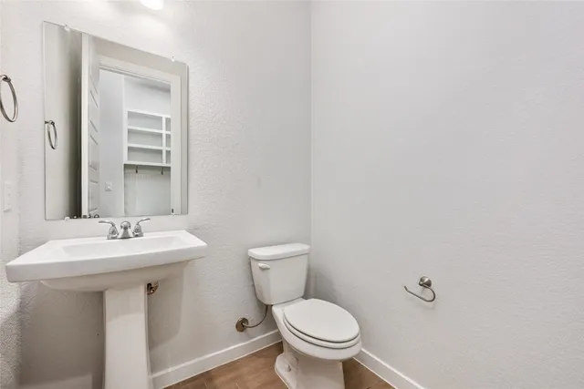 a bathroom with a bathtub and toilet