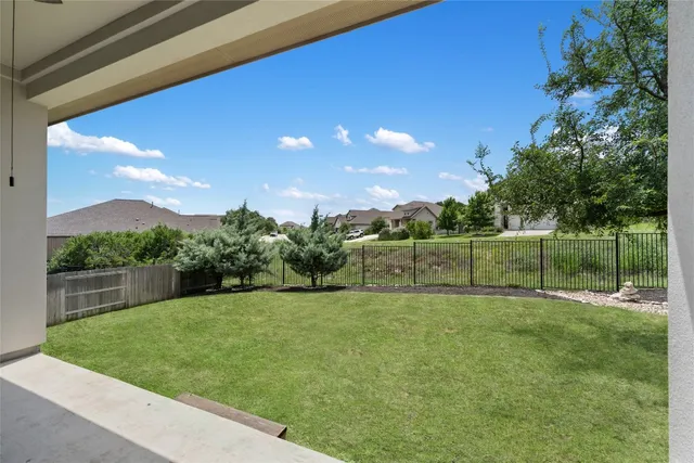a living room with a bed furniture and a window