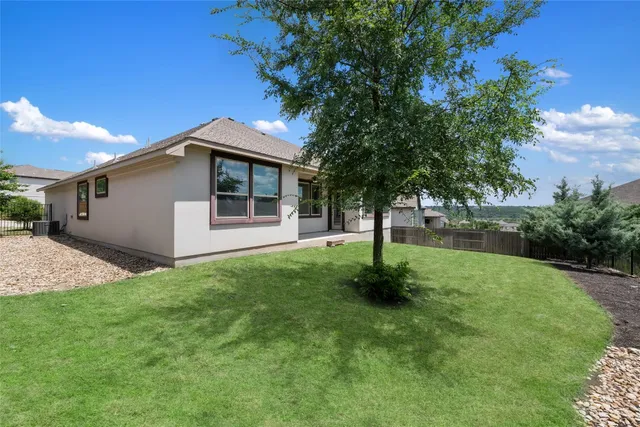 a front view of house with yard and outdoor seating