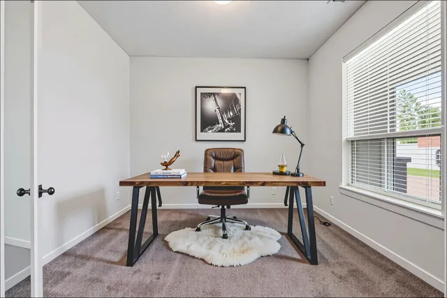 a view of a workspace with furniture