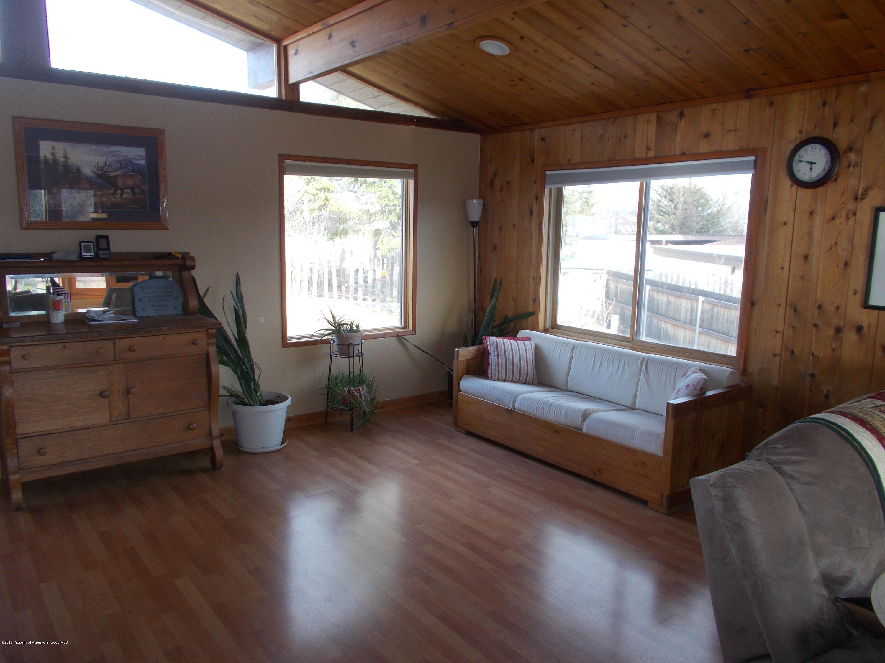 712 Buckeye Court Rifle, CO 81650 - Photo 12 of 22 a living room with furniture and a window