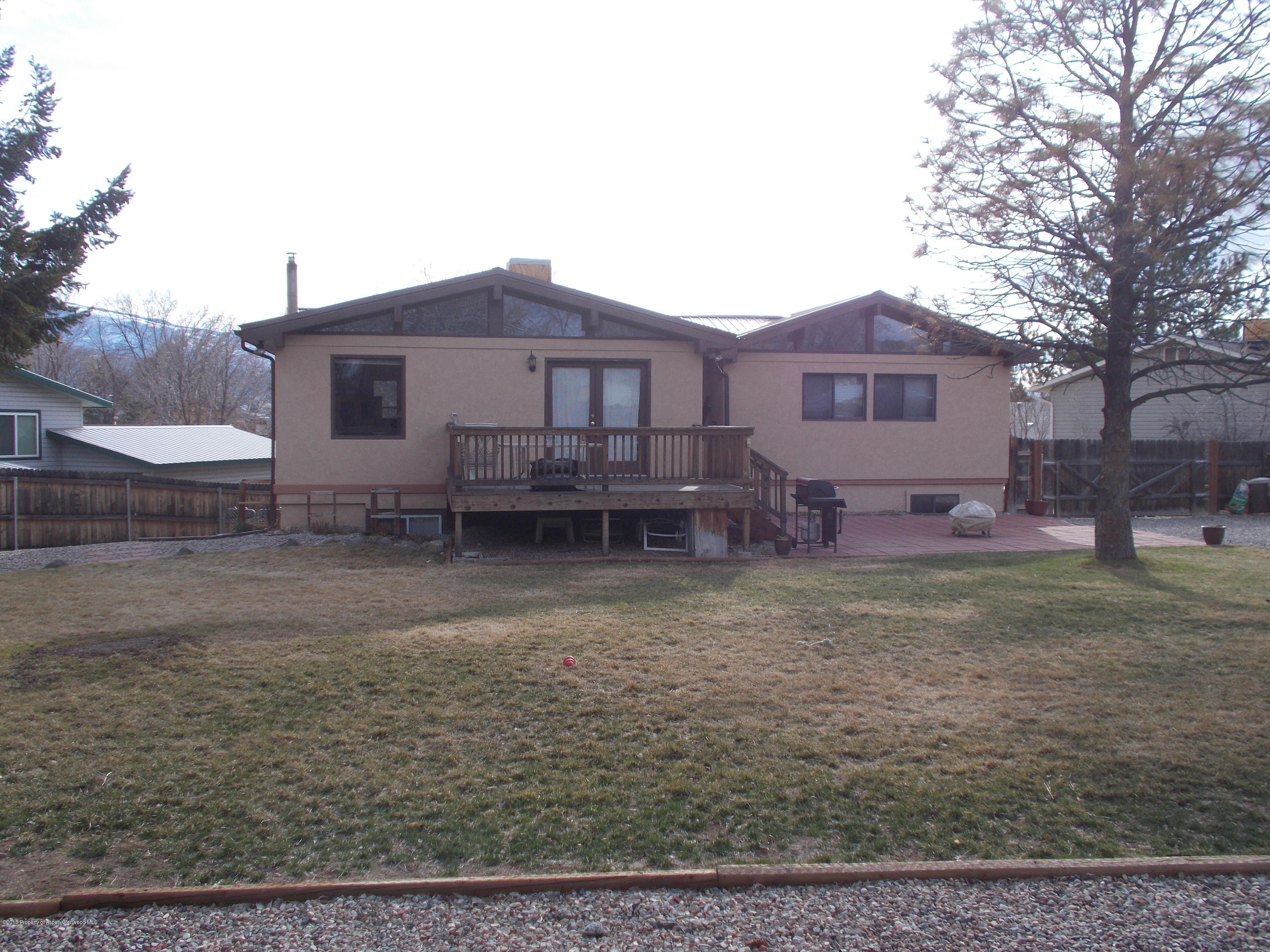 712 Buckeye Court Rifle, CO 81650 - Photo 5 of 22 a view of a house with a yard