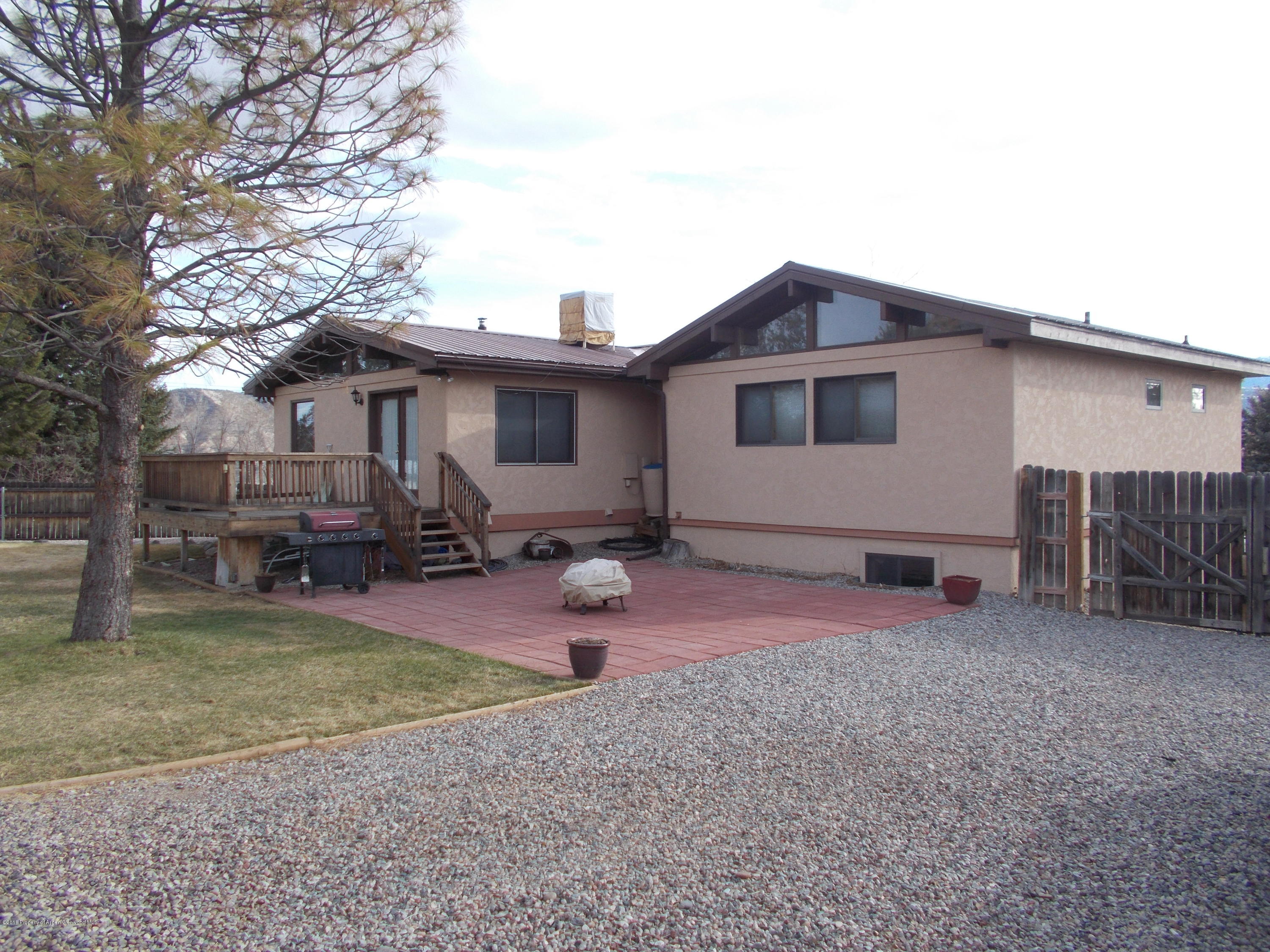 712 Buckeye Court Rifle, CO 81650 - Photo 6 of 22 a view of a house with backyard and porch