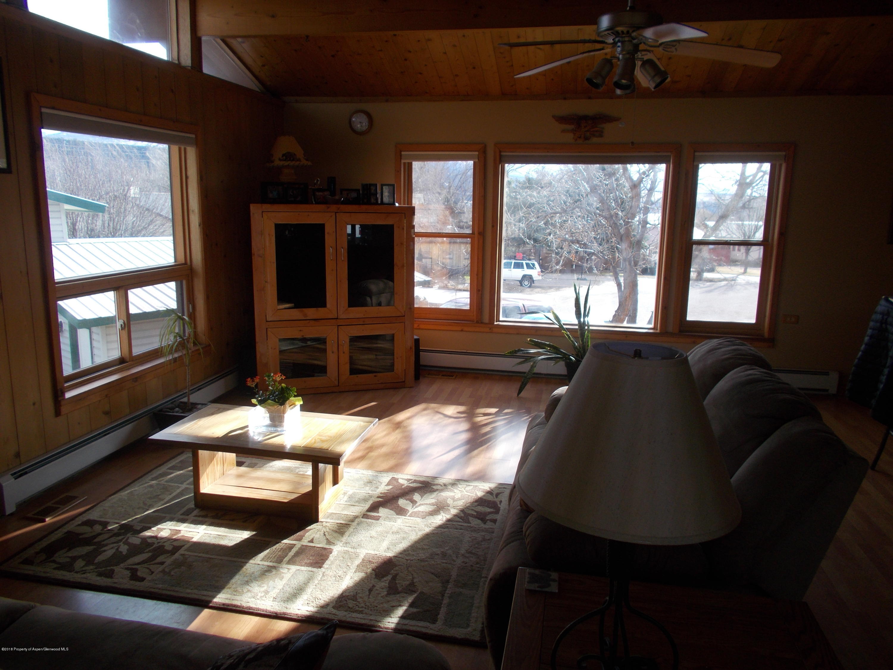 712 Buckeye Court Rifle, CO 81650 - Photo 10 of 22 a living room with furniture fireplace and flat screen tv