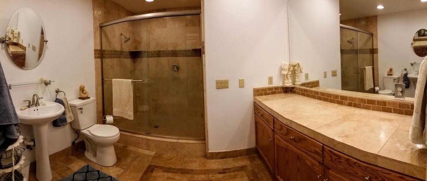 8906 North Applegate Road Grants Pass, OR 97527 - Photo 16 of 33 a bathroom with a granite countertop sink toilet and shower