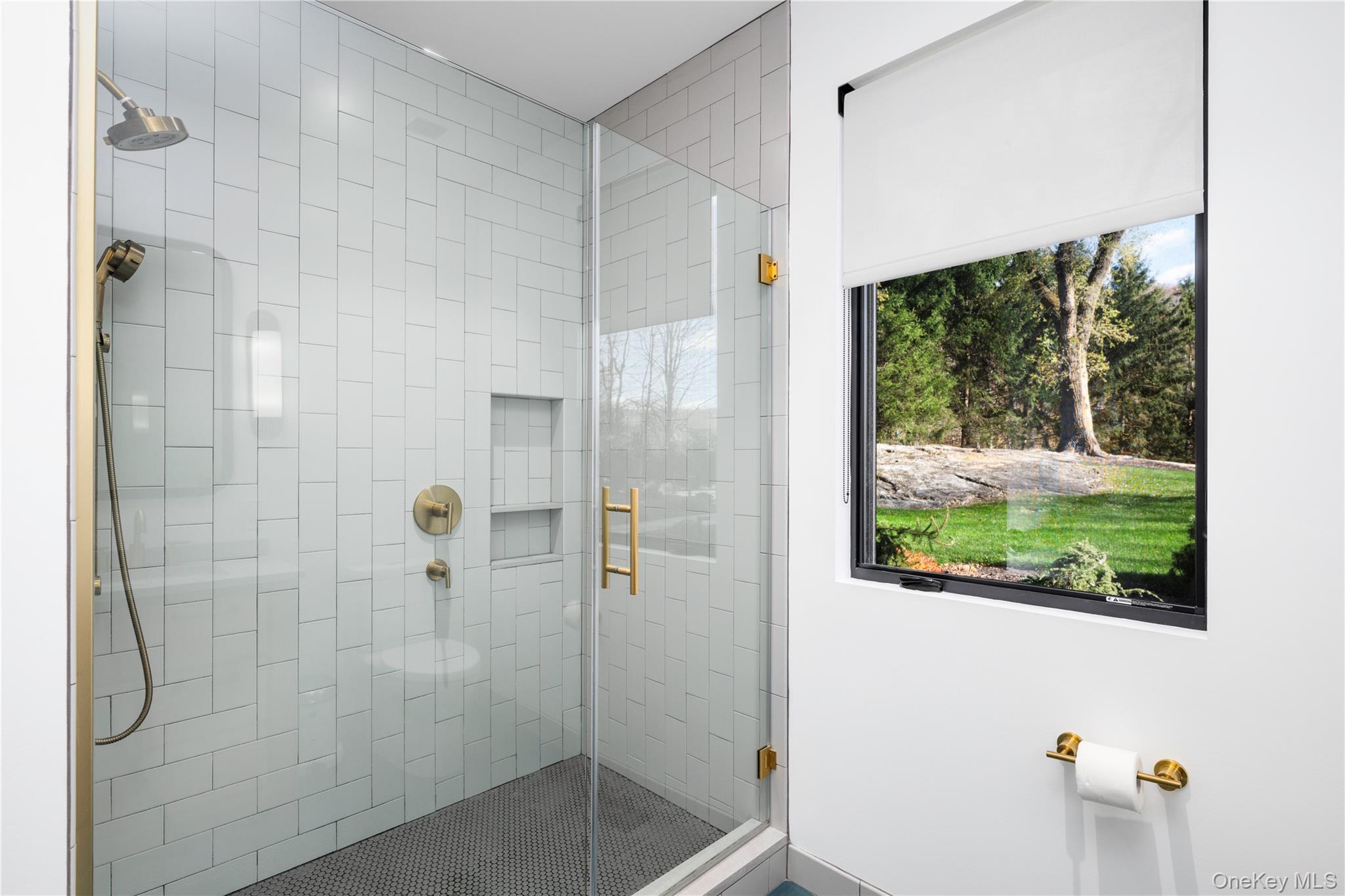 67 Dean Road Carmel, NY 10512 - Photo 20 of 29 Primary bath with window view of yard.