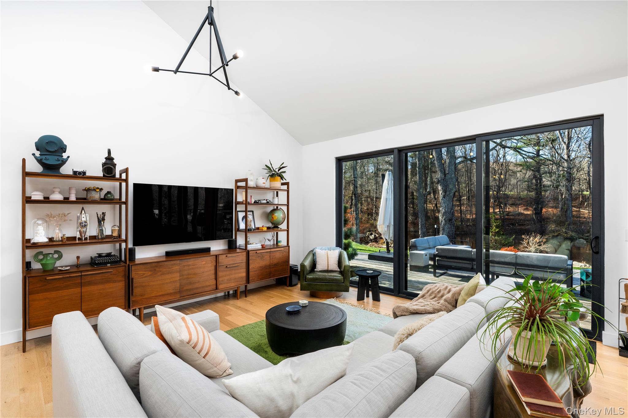 67 Dean Road Carmel, NY 10512 - Photo 7 of 29 Sliding glass doors providing outdoor access across the entire back of the home.