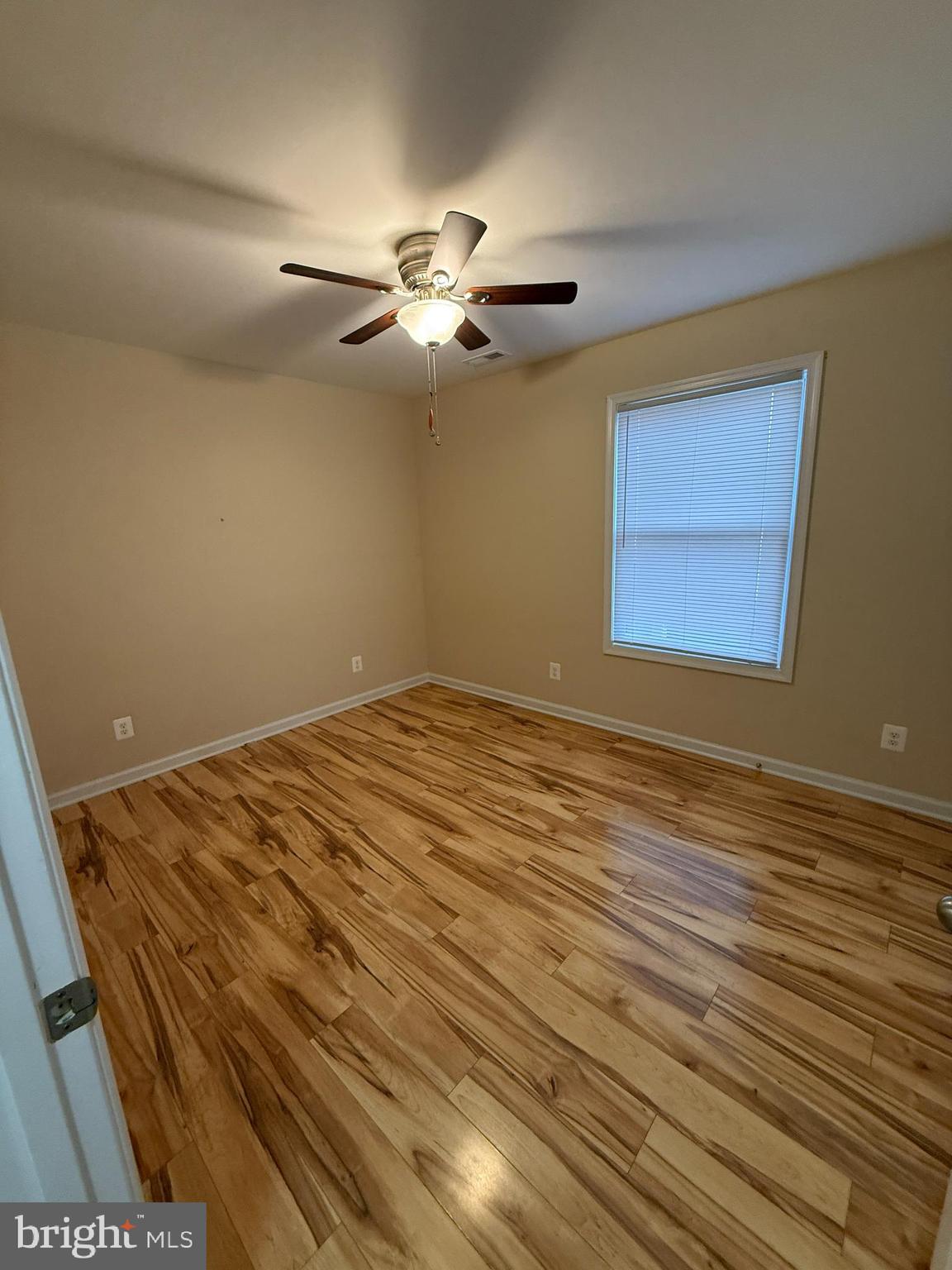 3385 Howellsville Road Front Royal, VA 22630 - Photo 14 of 19 a view of a room with wooden floor and a ceiling fan
