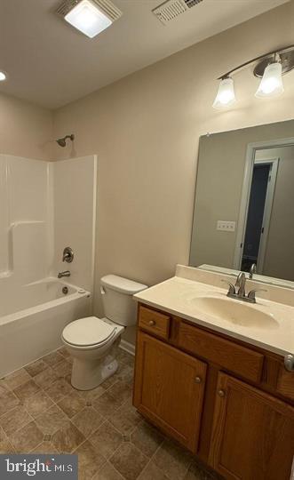 3385 Howellsville Road Front Royal, VA 22630 - Photo 15 of 19 a bathroom with a sink a toilet a mirror and bathtub